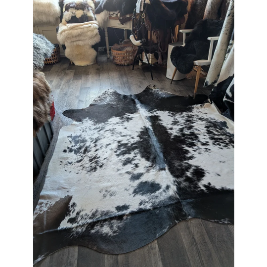 Large black and white cowhide rug salty