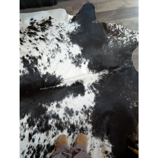 Extra large black and white cowhide rug salty5 with natural fur texture adds rustic charm and beauty to any room