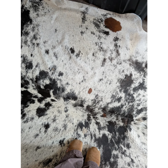 Salty9 extra large black and white cowhide rug with natural textured surface perfect for rustic charm and beautiful rugs