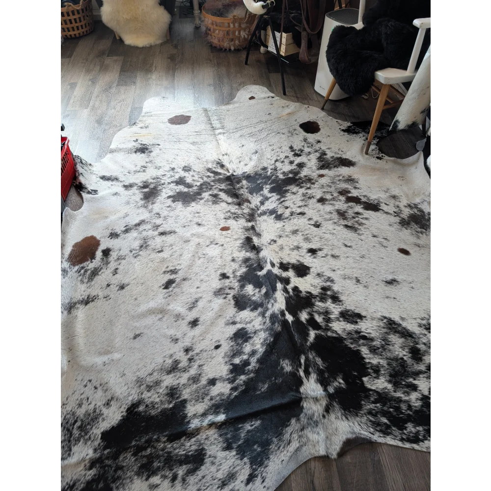 Salty9 extra large cowhide rug with natural white and black patches adds rustic charm to any space with beautiful rugs