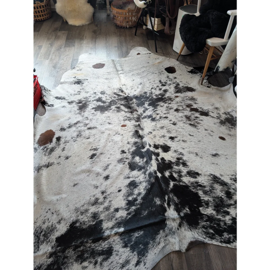 Salty9 extra large cowhide rug with natural white and black patches adds rustic charm to any space with beautiful rugs