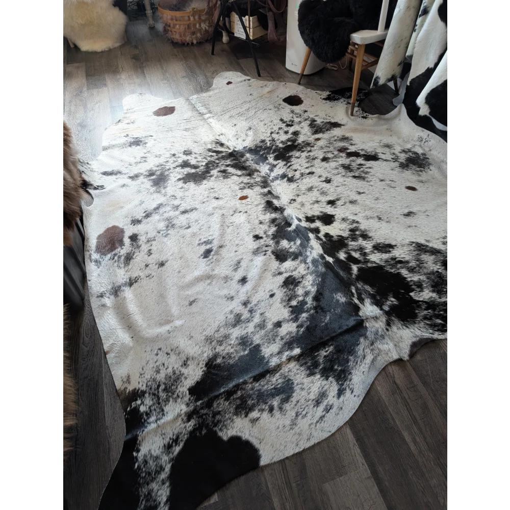 Salty9 large cowhide rug with natural white and black patches adds rustic charm to any room with beautiful rugs