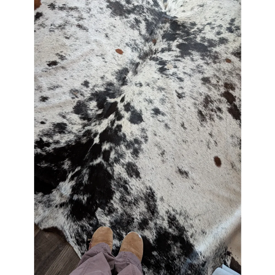 Salty9 large cowhide rug with natural black and white spotted pattern adds rustic charm to any space