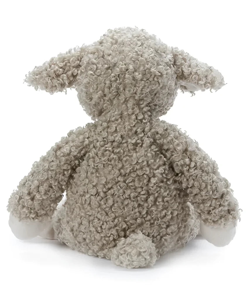 Sammy the Sheep is a soft beige curly-furred stuffed lamb toy with white paws and a fluffy tail