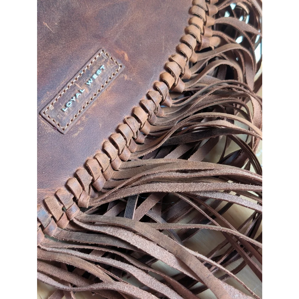 Brown leather sedona tassle bag in saddle brown with fringe, braided detailing, and loyal west brand patch