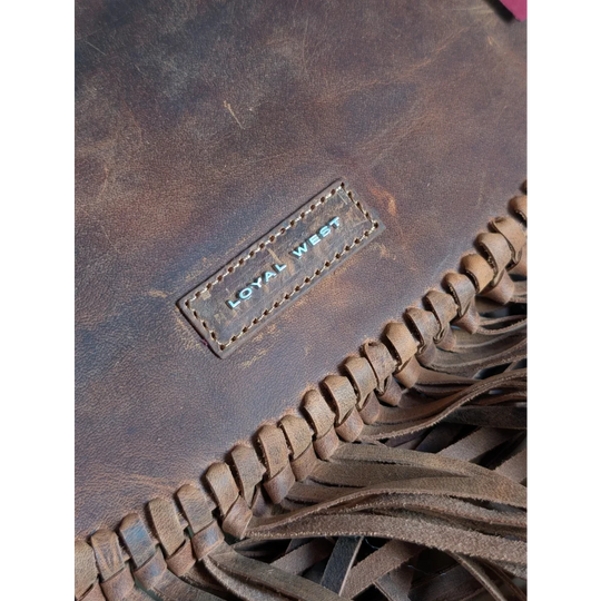 Brown leather sedona tassle bag with fringed detailing and loyal west brand patch in saddle brown