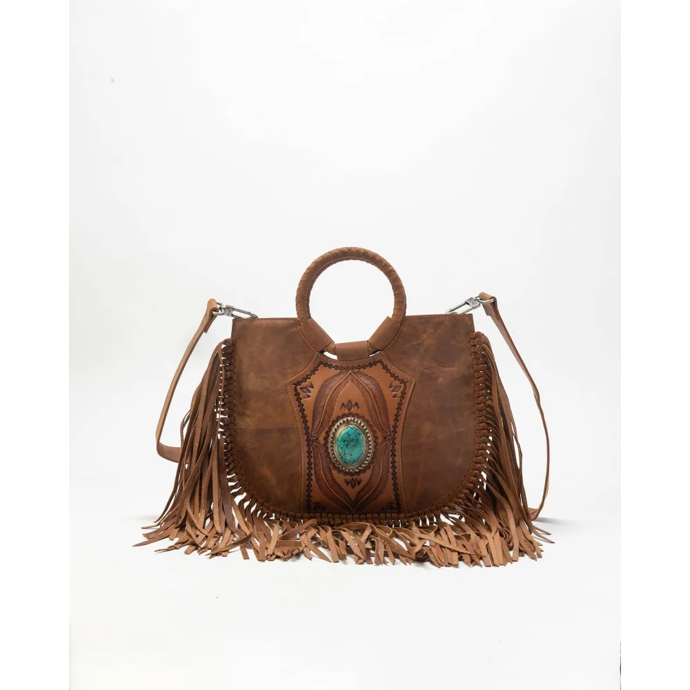 Sedona tassle bag in saddle brown with fringed edges and turquoise stone