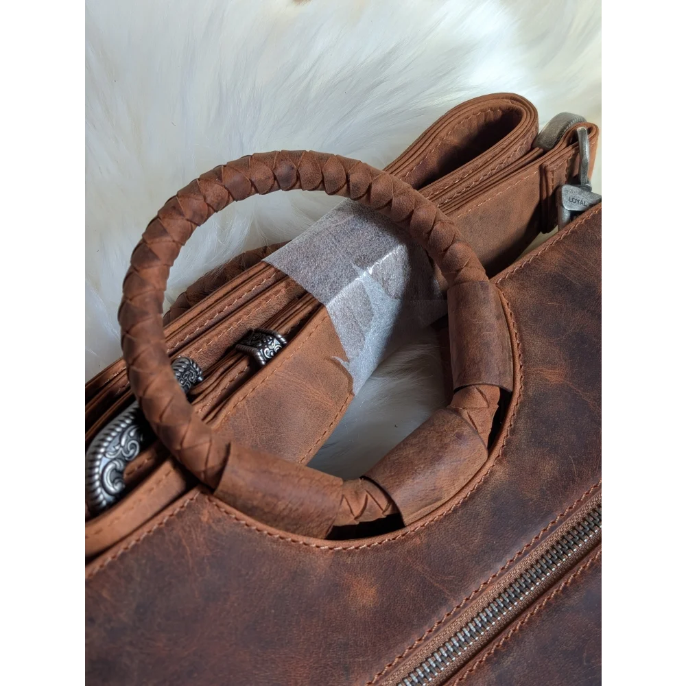 Brown leather sedona tassle bag with braided handles and silver hardware perfect for everyday use