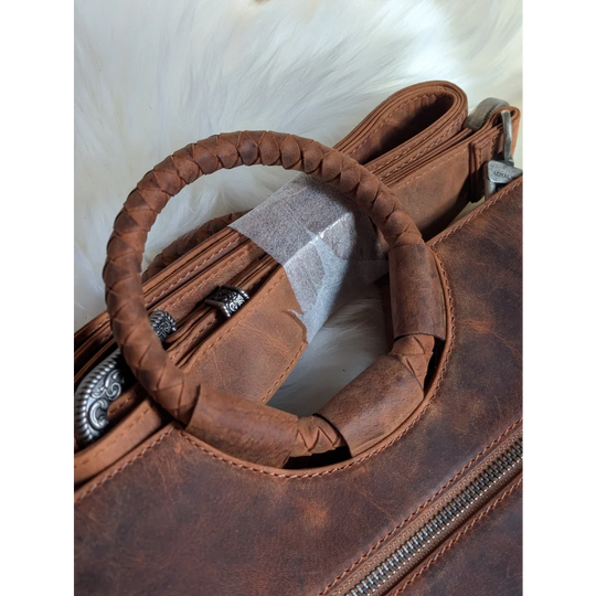 Brown leather sedona tassle bag with braided handles and silver hardware perfect for everyday use