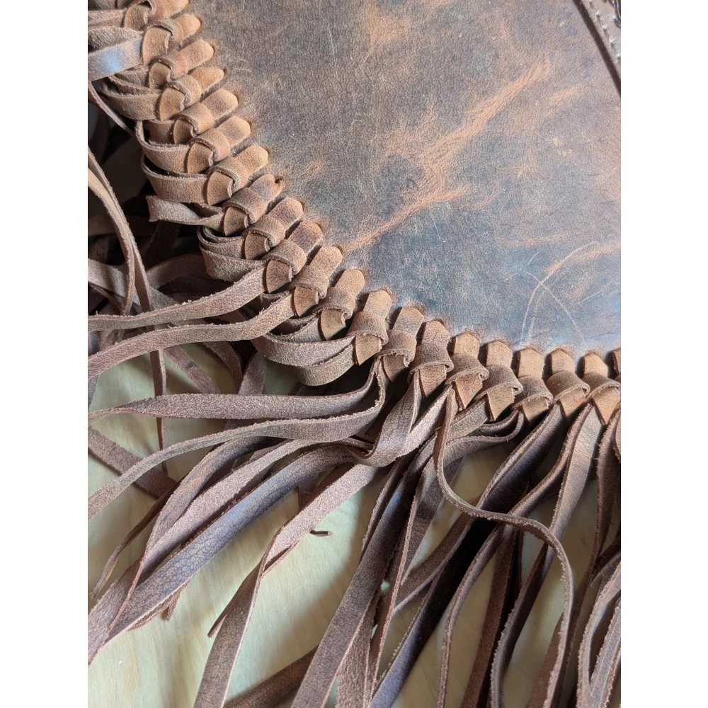 Brown leather sedona tassle bag in saddle brown with fringe and braided edge detailing for casual use