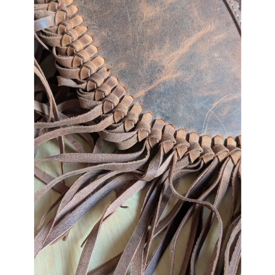 Brown leather sedona tassle bag in saddle brown with fringe and braided edge detailing for casual use