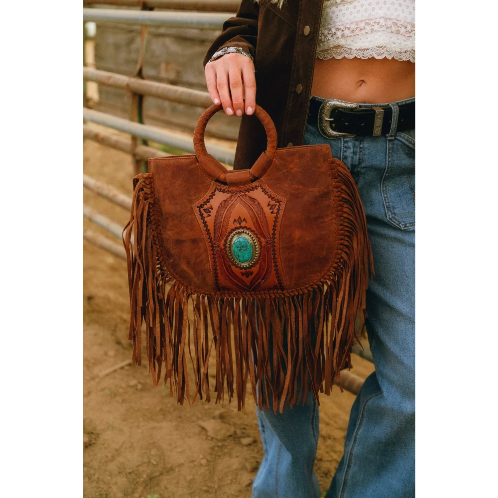 Sedona tassle bag in saddle brown with fringes, circular handle, turquoise stone