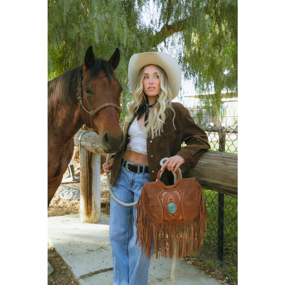 Sedona tassle bag in saddle brown with fringes and turquoise stone