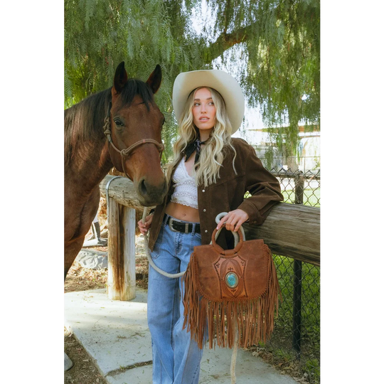 Sedona tassle bag in saddle brown with fringes and turquoise stone