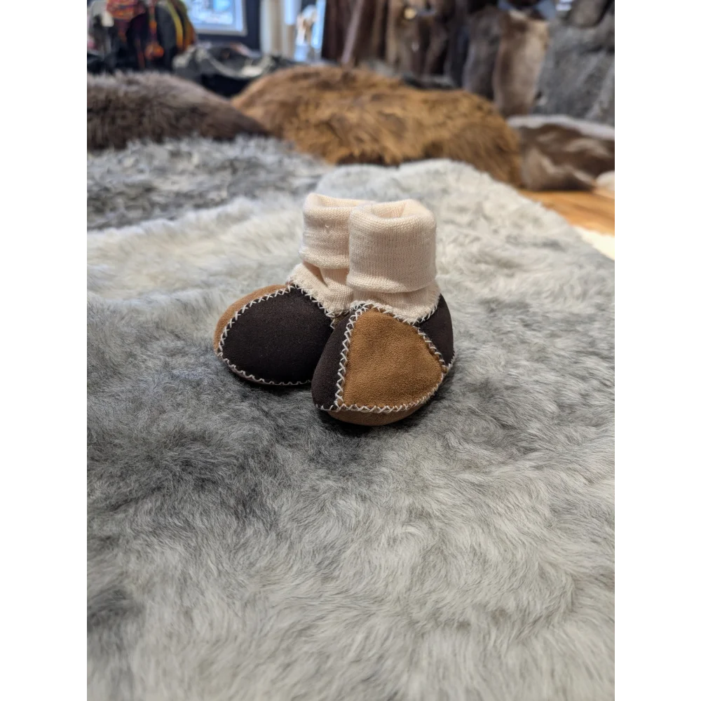 Cute sheepskin baby booties in brown and tan with soft cuffs from Set of 4 Pairs