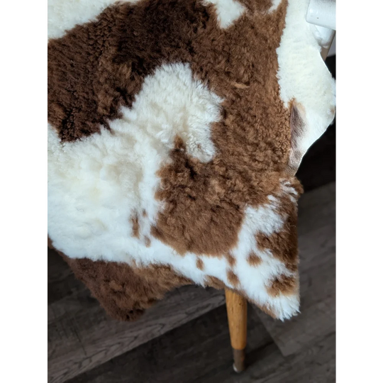 Brown and white plush fluffy tibet highland spotted sheepskin rug perfect for cozy home decor