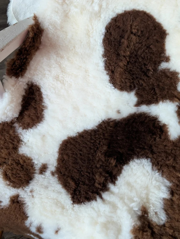 Brown and white tibet highland spotted sheepskin rug 40 x 25 inches soft grade a highland spotted sheepskin