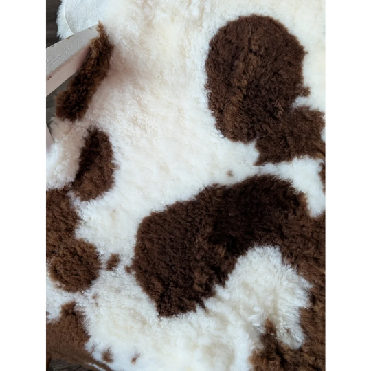 Brown and white tibet highland spotted sheepskin rug 40 x 25 inches soft grade a highland spotted sheepskin