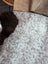 A cozy 39x26 inch tibet highland spotted sheepskin coat with soft white and brown fleece exterior grade a