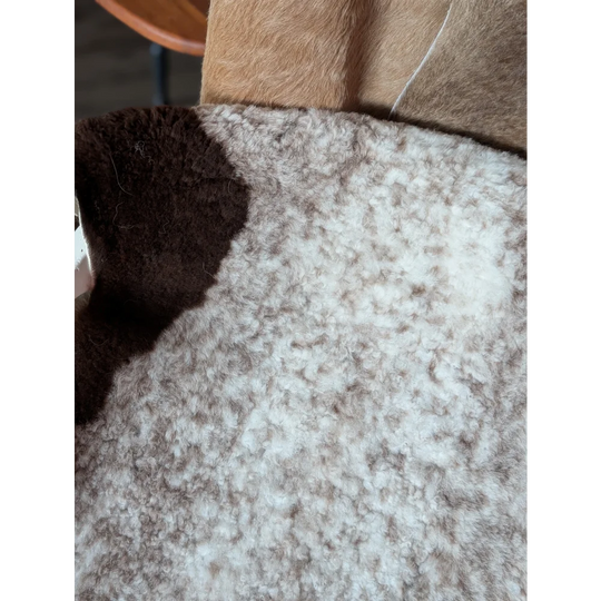 A cozy 39x26 inch tibet highland spotted sheepskin coat with soft white and brown fleece exterior grade a