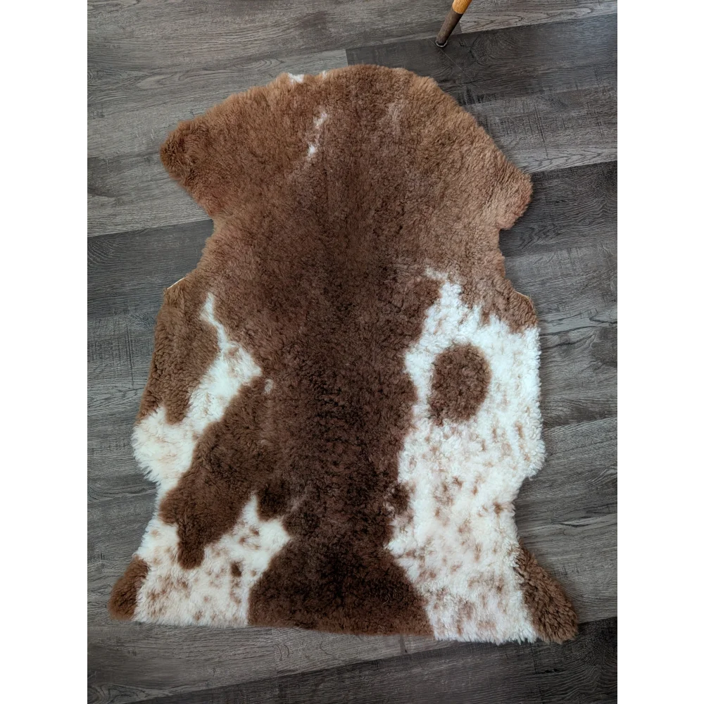 Brown and white tibet highland spotted sheepskin rug with plush fluffy texture 40 x 25 inches grade a quality