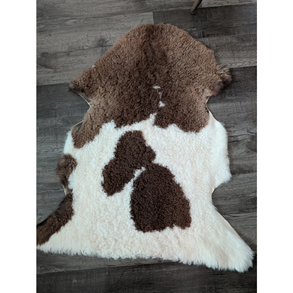 Brown and white fluffy tibet highland spotted sheepskin rug with natural texture for cozy home decor