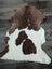 Brown and white fluffy tibet highland spotted sheepskin rug with natural texture for cozy home decor