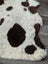 A cream highland spotted sheepskin rug with irregular dark brown spots from tibet highland spotted grade a collection