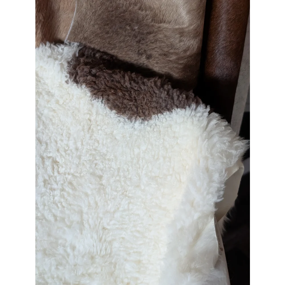 White fluffy sheepskin vest with brown fleece collar made from grade a tibet highland spotted sheepskin