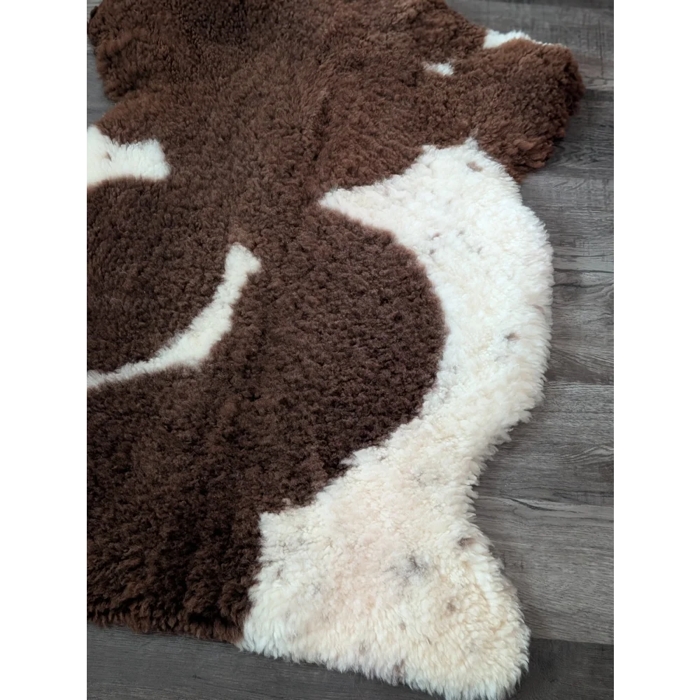 Brown and white highland spotted sheepskin rug 41 by 26 inches made from grade a tibet highland spotted wool