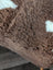 Brown tibet highland spotted sheepskin fabric with white patches for cozy home decor or rugs