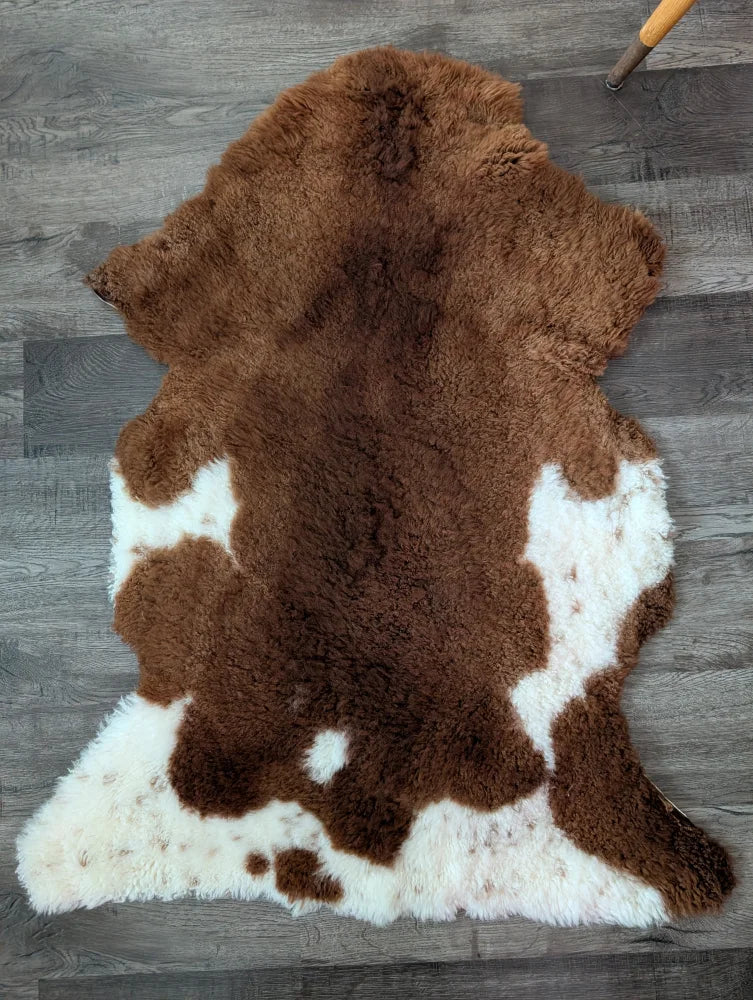 Brown and white gorgeous tibet highland spotted sheepskin rug with plush natural fur texture 43 x 26 inches