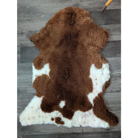 Brown and white gorgeous tibet highland spotted sheepskin rug with plush natural fur texture 43 x 26 inches