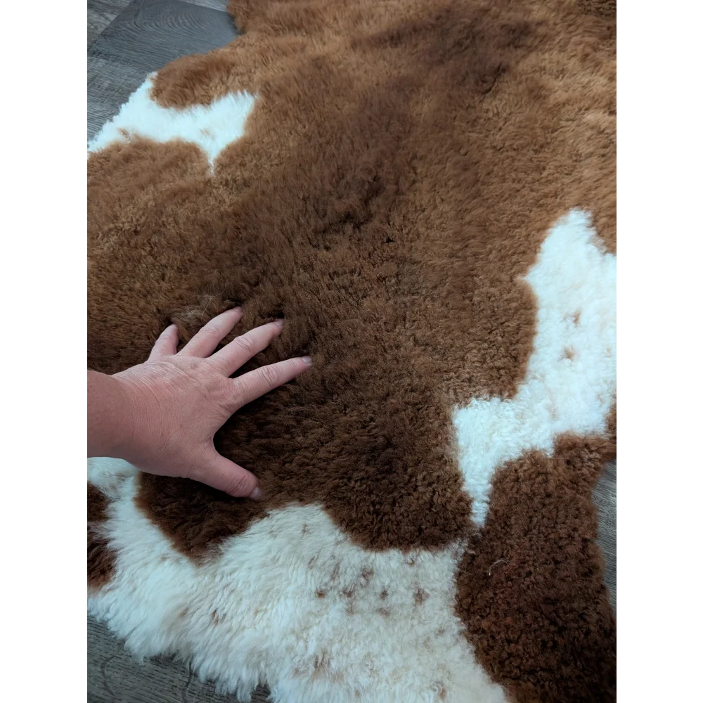 Brown and white highland spotted sheepskin rug with plush fluffy texture 43 x 26 inches grade a tibet highland spotted