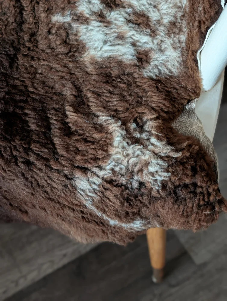 Cozy brown and cream highland spotted sheepskin rug with soft textured surface made from tibet highland spotted grade a wool