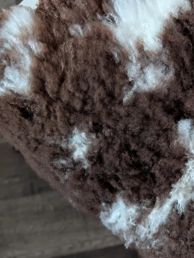 Soft fluffy fluffy brown and white tibet highland spotted sheepskin with curly texture 42 by 27 inches