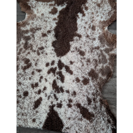 Brown and white tibet highland spotted sheepskin rug with natural fluffy texture 40.5 x 24.5 inches grade a