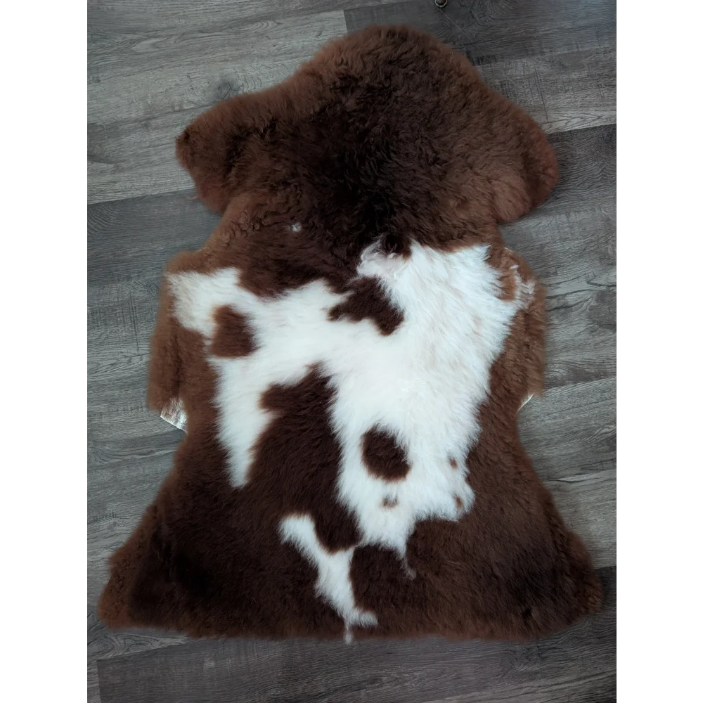 Brown and white highland spotted sheepskin rug 42 by 25 inches made from tibet highland spotted wool