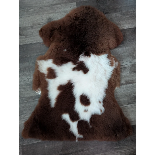 Brown and white highland spotted sheepskin rug 42 by 25 inches made from tibet highland spotted wool