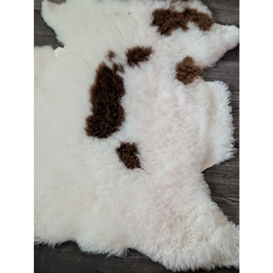 White and brown fluffy tibet highland spotted sheepskin rug perfect for cozy home decor and comfort