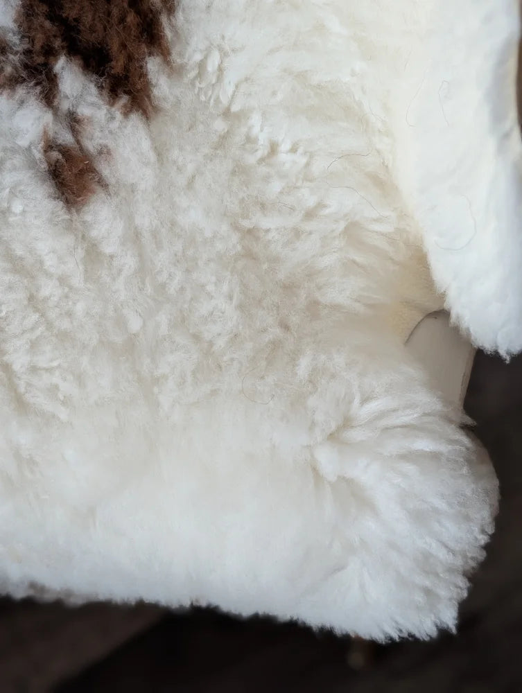 White fluffy tibet highland spotted sheepskin rug with brown patch 41 by 26.5 inches grade a quality