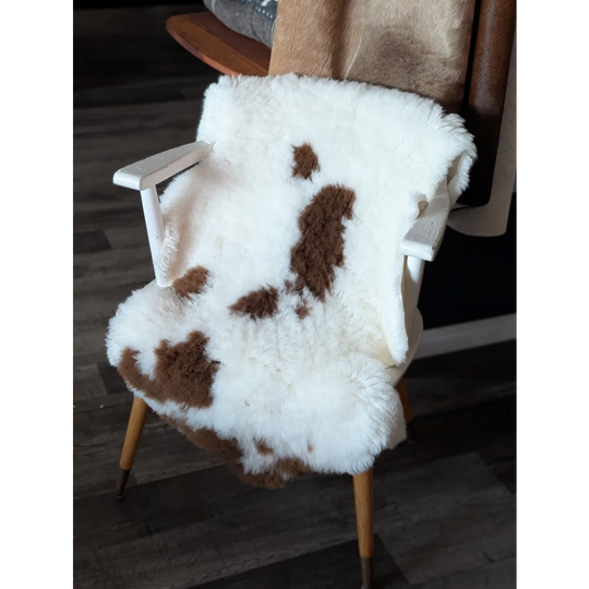 White and brown fluffy highland spotted sheepskin chair cover made from grade a tibet highland spotted sheepskin
