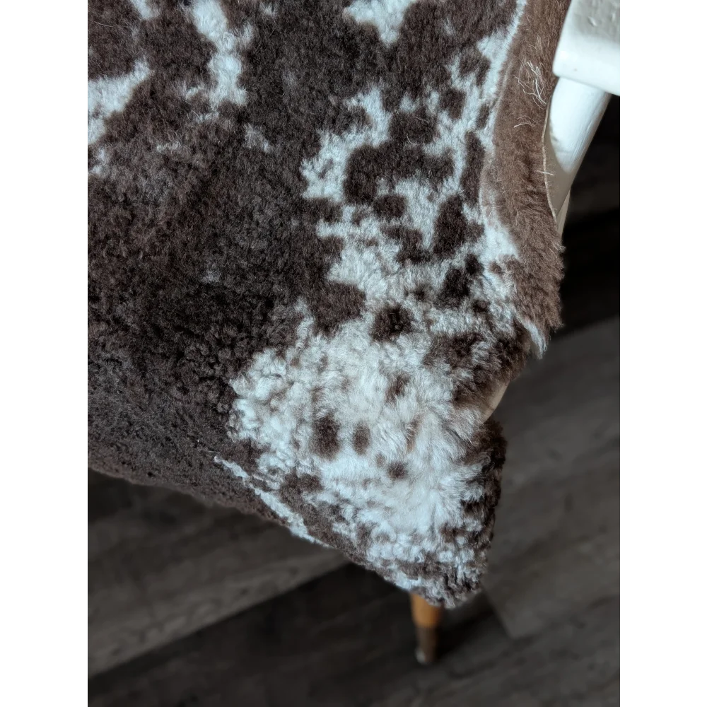 Brown and white spotted tibet highland spotted sheepskin blanket with soft fluffy texture 40 by 25 inches grade a