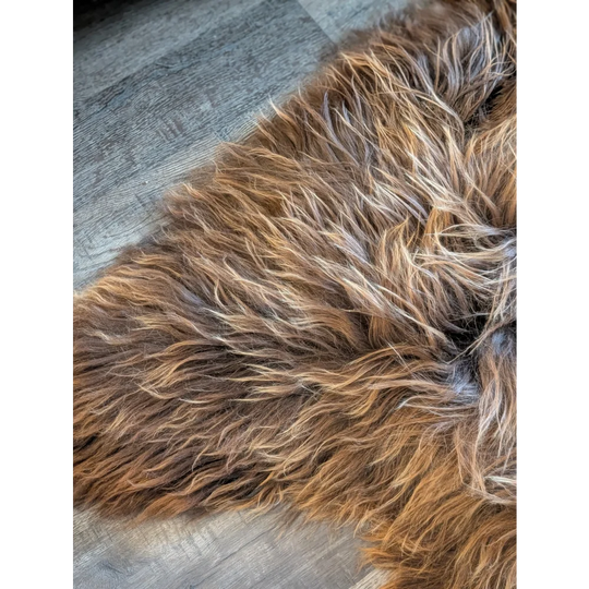A plush shaggy brown and tan wool icelandic rug with long wool icelandic texture in natural bronze color