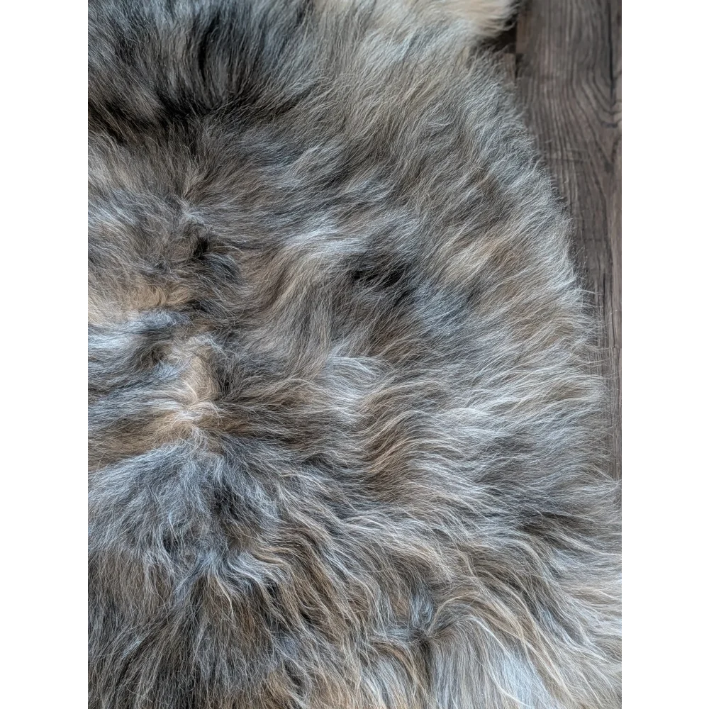 A plush gray and beige double icelandic sheepskin rug with natural wool texture and soft fluffy feel