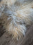 A massive icelandic sheepskin rug in natural grey with double icelandic wool texture measuring 57 by 35 inches