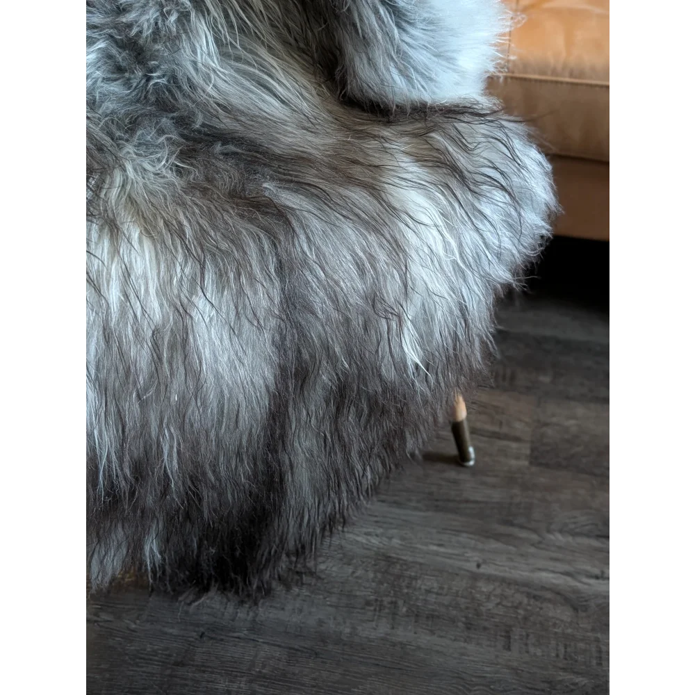 A plush 54 x 34 inch double icelandic sheepskin throw in natural grey with soft long-haired wool icelandic texture