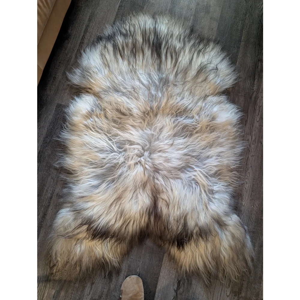 A plush double icelandic sheepskin rug in natural grey with soft dense wool icelandic fur tones cream beige and dark brown
