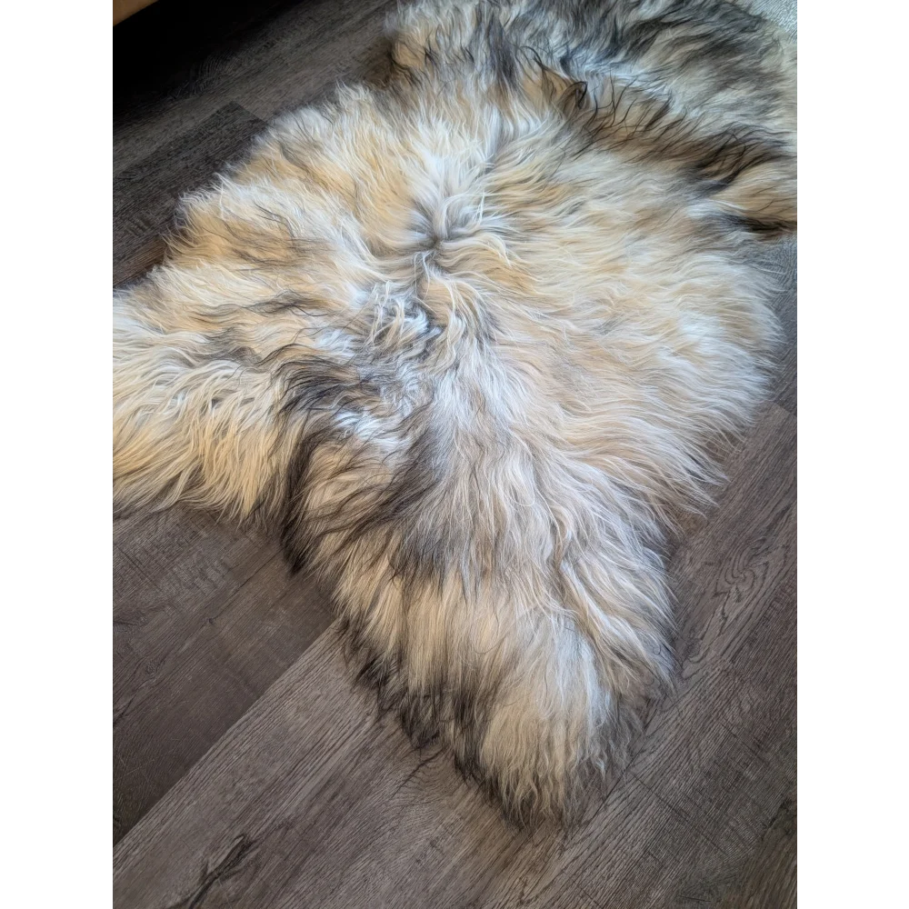A massive icelandic sheepskin rug 58 x 32 with natural grey tones and soft double icelandic wool texture