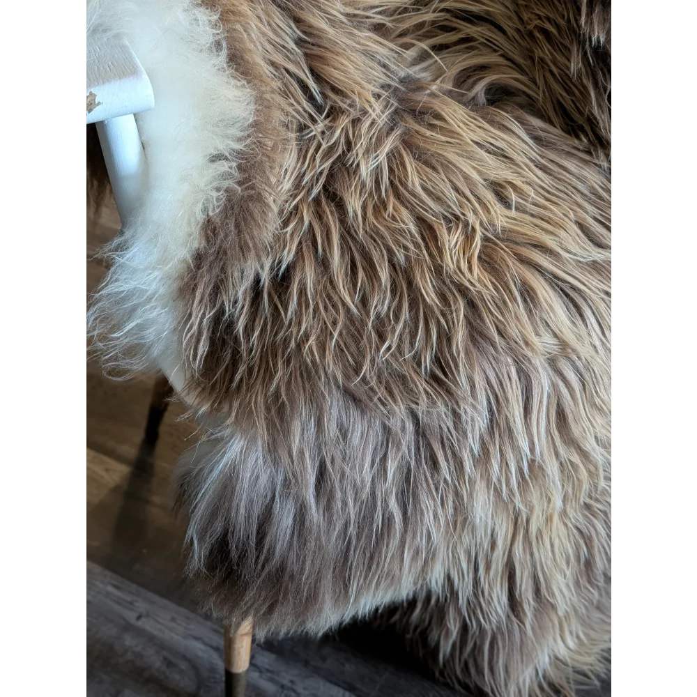 A plush 58 x 34 inch massive icelandic sheepskin throw in natural bronze with long wool icelandic texture